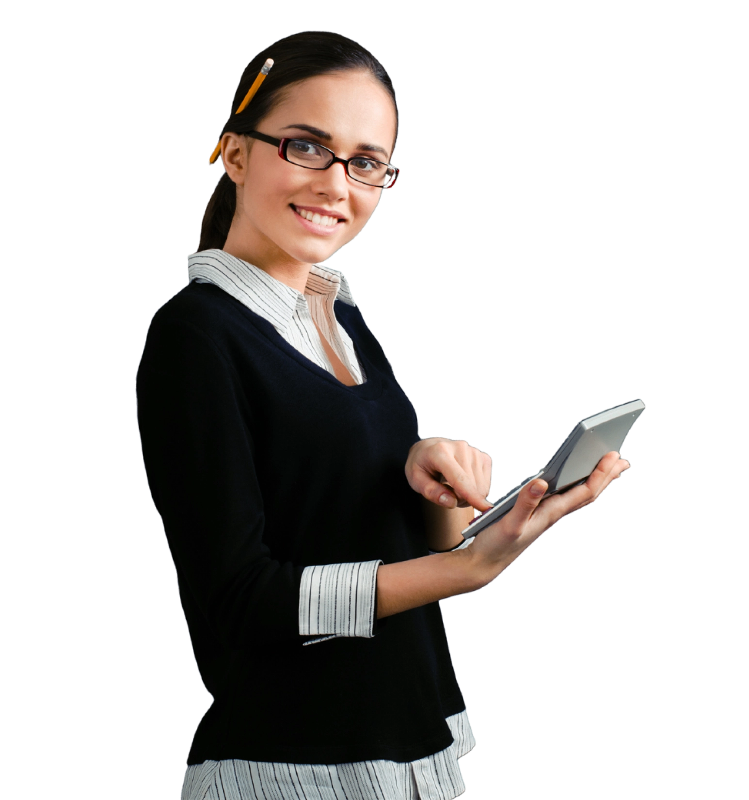 A woman with glasses and a pencil in her hair uses a calculator while smiling, wearing a black sweater over a striped shirt.